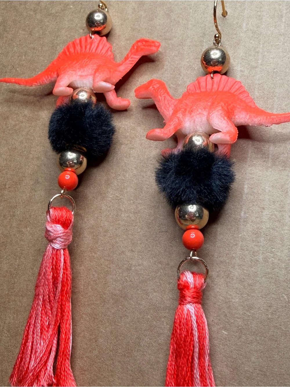 Fun Orange Dinosaur Tassel Earrings with Black Pom Pom Bead